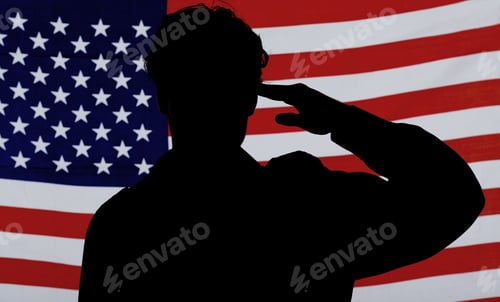 Preview: Respect for his country. Silhouette of a soldier saluting against an American flag.