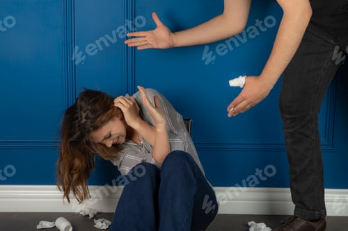 Preview: Young girl sitting on the floor and a man bullying him
