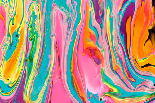 Preview: Close-up shot of thick paint of various bright colors flowing down and mixing together
