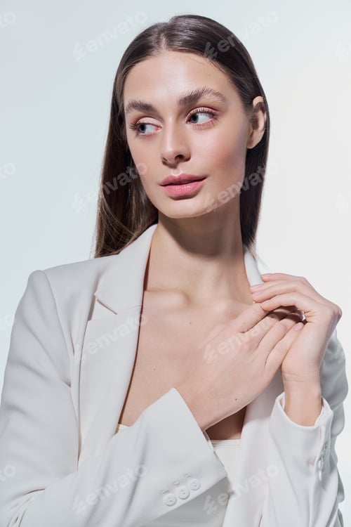 Preview: Elegant Woman Poses in White Jacket