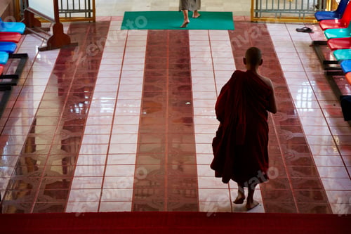Preview: Rear view of silhouetted buddhist monk in temple, Yangon, Myanmar