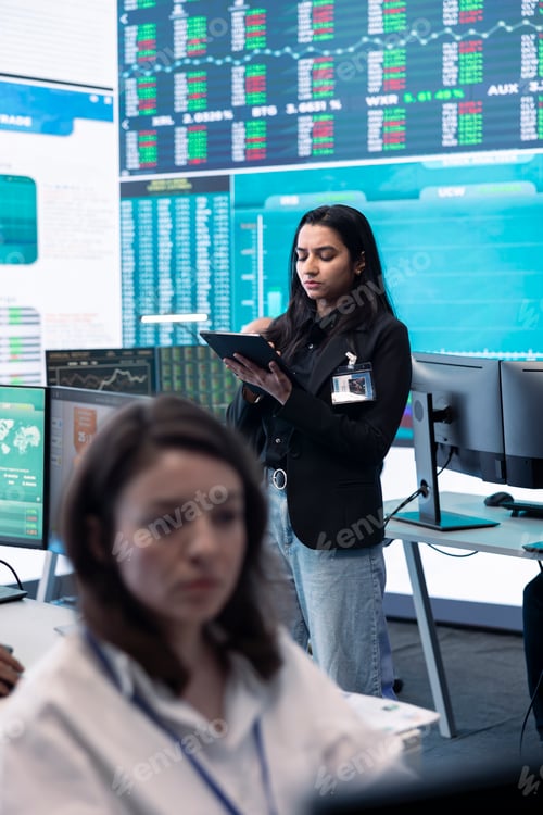 Preview: Team of forecast affiliates examining annual infographics on a big data screen