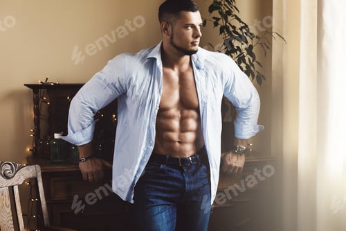 Preview: Handsome bearded young man wearing blue shirt