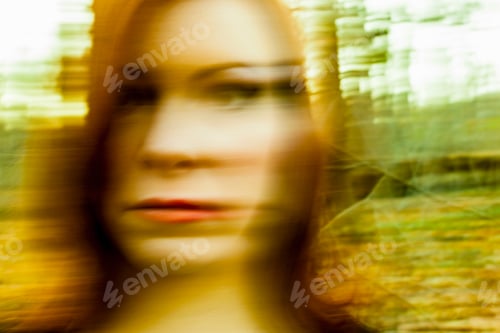 Preview: Portrait of mid adult woman, outdoors, blurred motion