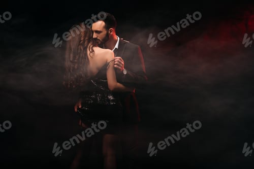 Preview: sensual loving couple hugging in dark smoky room