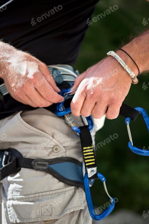 Preview: Rock climber checking equipment