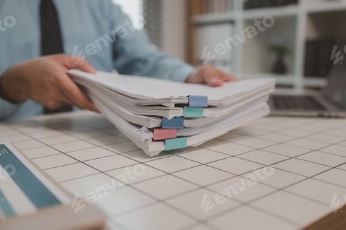 Preview: a businessman is handling documents in the office, an accountant is collecting documents