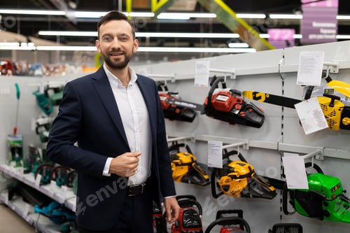 Preview: store manager offers chainsaws to choose from