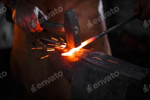 Preview: Blacksmith manually forging the molten metal