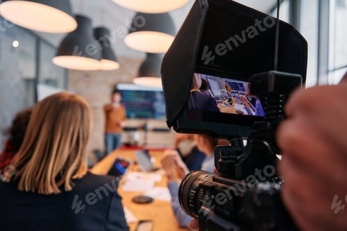 Preview: Capturing Corporate Dynamics: Videographer Films Business Meeting in Modern Office.
