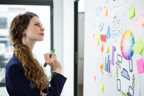 Preview: Thoughtful woman looking at adhesive notes