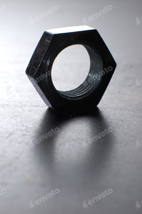 Preview: Close-up of one chrome hexagon metal nut