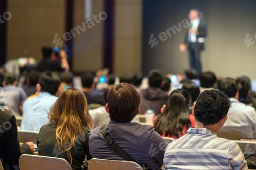 Preview: Rear side of Audiences sitting and listening the speackers on the stage in low light conference hall