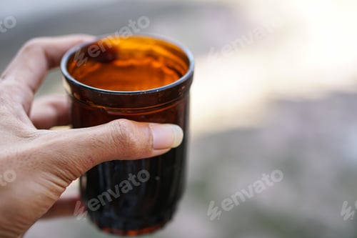 Preview: hand holding a cup of water