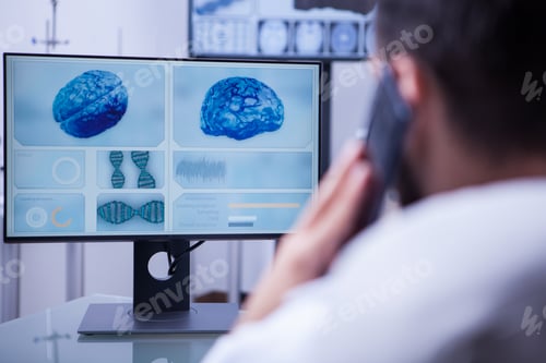 Preview: Doctor using smartphone to help a patient sitting in his office