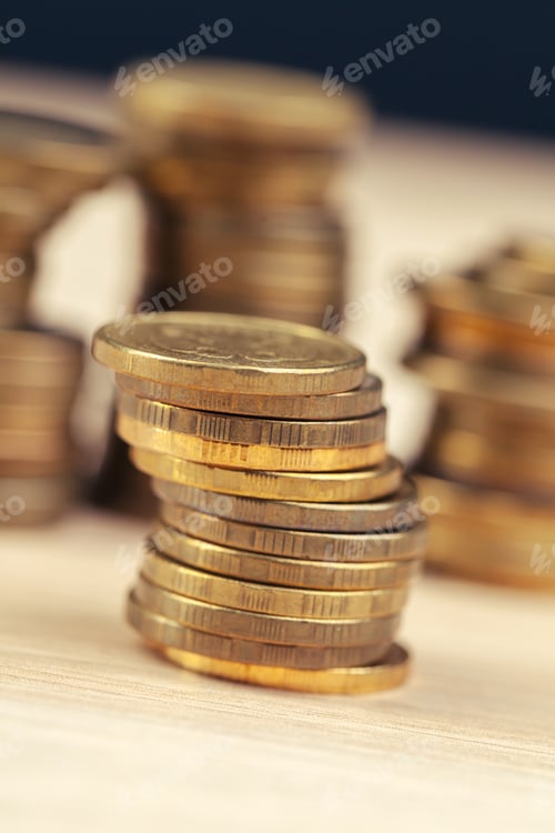 Preview: piles of coins on working table