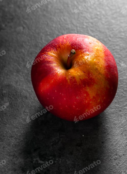 Preview: Apples in a dramatic low key concept with a dark background in variety angles