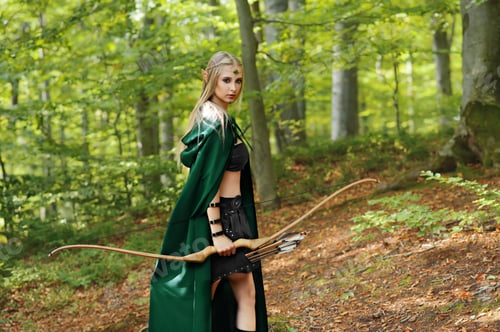 Preview: Beautiful female elf archer in the forest hunting with a bow