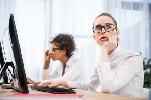 Preview: young tired teenager girls studying on computers