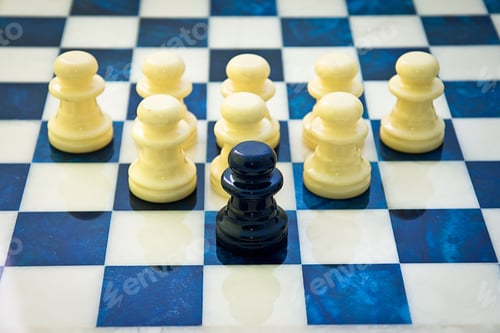 Preview: White chess pieces in front of a single black piece-teamwork, strategy concept