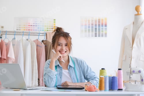 Preview: Fashion designer working in studio