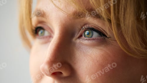 Preview: Close Up Portrait Of Woman With Nose Piercing Against Neutral Plain Studio Background