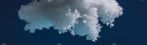 Preview: white fluffy cloud made of cotton wool isolated on dark blue, panoramic shot