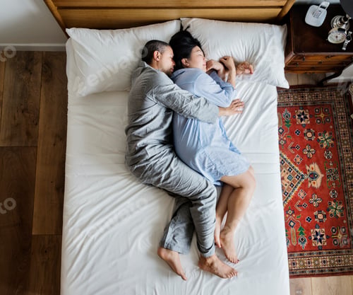 Preview: Interracial couple sleeping together on the bed
