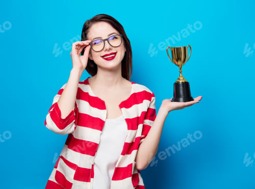 Preview: young smiling woman with cup trophy