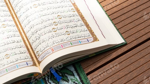 Preview: Holy Book Al Quran that Open with Prayer Mat