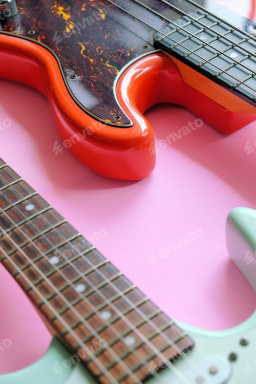 Preview: Electric guitar and bass guitar on a pink background