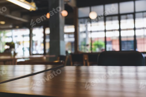 Preview: Wooden table top with blurred background in cafe