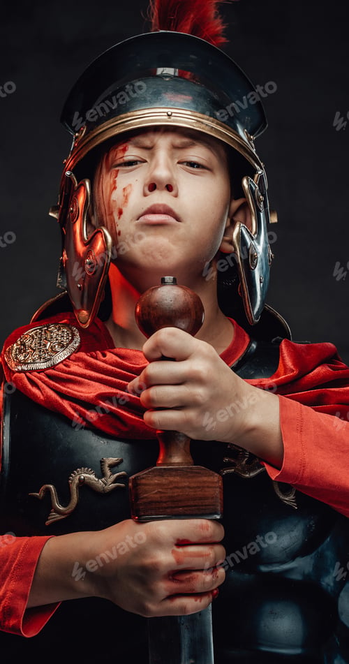 Preview: Cheerful boy dressed like legionary poses with sword