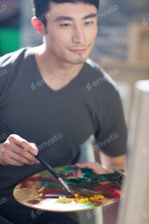 Preview: Artist painting in his studio