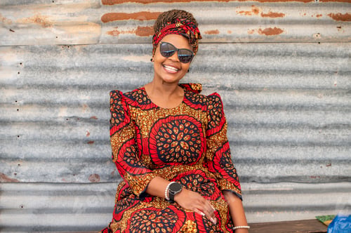 Preview: Portrait of smiling woman in stylish wear
