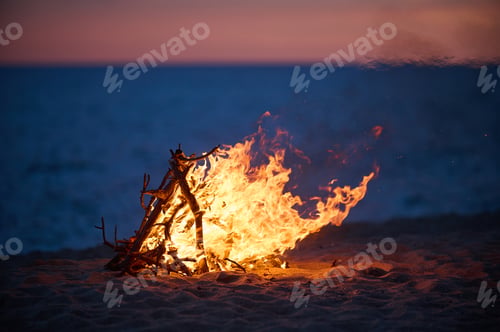 Preview: Beach Bonfire selective focus with Beautiful Sunset or sunrise nobody