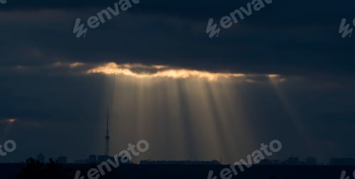 Preview: Sun rays break through the clouds. Autumn sunrise.