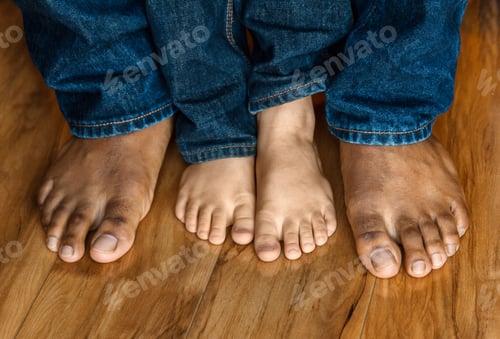 Preview: Father’s and son’s feet, barefoot at natural light