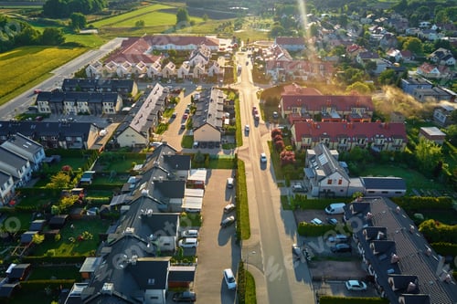 Preview: Aerial view of suburban neighborhood with modern houses and green gardens