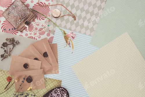 Preview: top view of envelopes and jewelry box over pack paper background