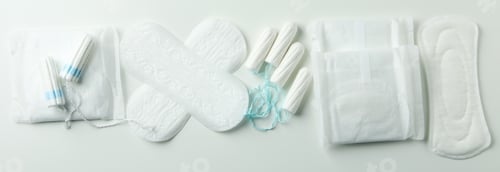 Preview: Concept of menstruation on white background, top view