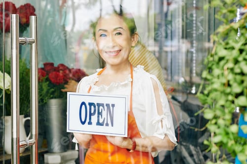 Preview: Flower shop owner turning open sign