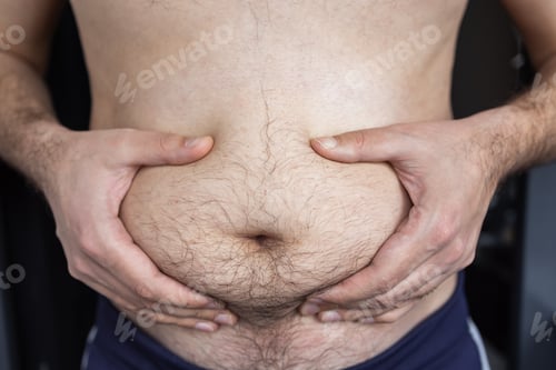 Preview: Man touching his fat belly