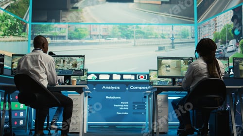 Preview: Diverse employees working on examining real time surveillance footage