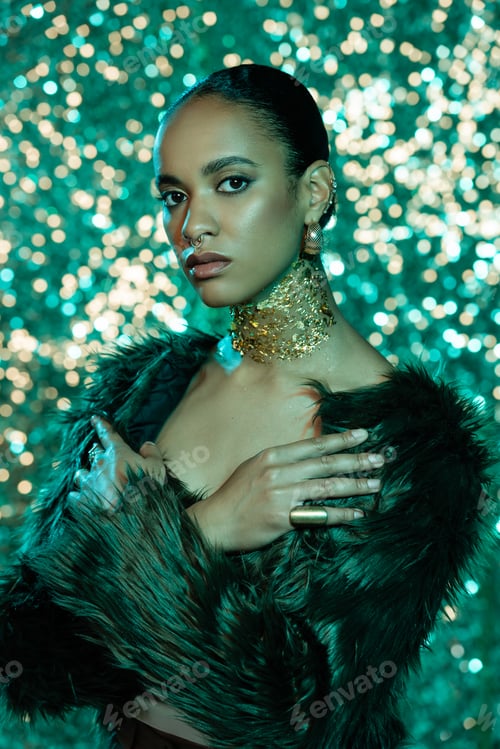 Preview: young african american woman in faux fur jacket and gold on neck posing with crossed arms on