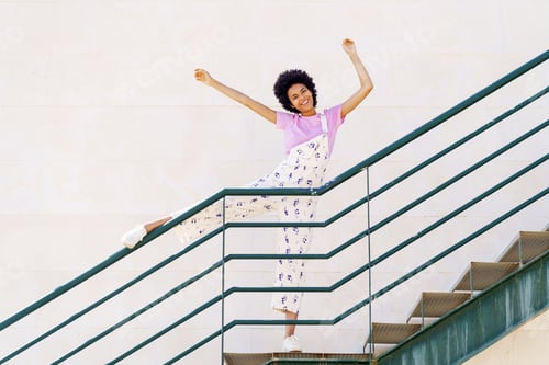 Preview: Funny black woman standing on stairway