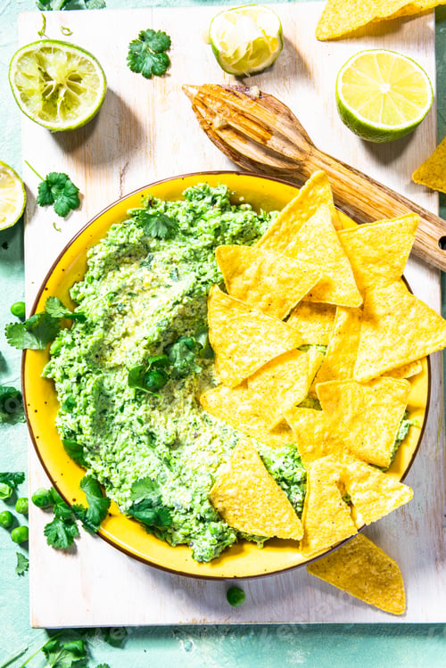 Preview: Nachos with green peas guacamole. Healthy vegetarian avocado alternative food