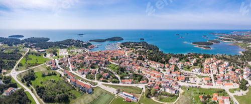 Preview: View of an Island with trees surrounded by water on a sunny day in Croatia