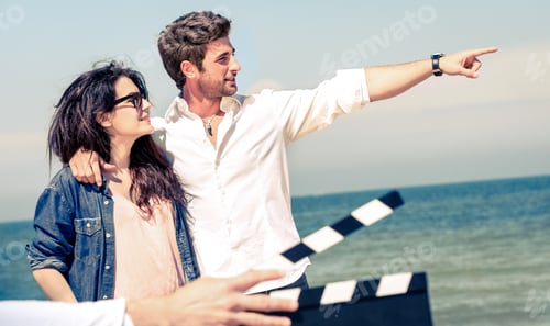 Preview: Young couple in love acting for romantic film at beach