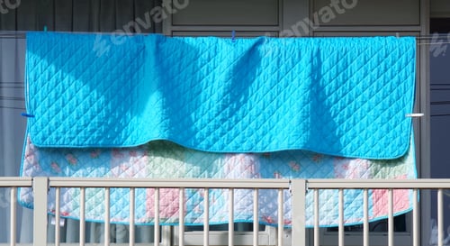 Preview: Clean colorful blanket hanging in the balcony